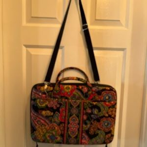Vera Bradley hard shell laptop case with shoulder strap.